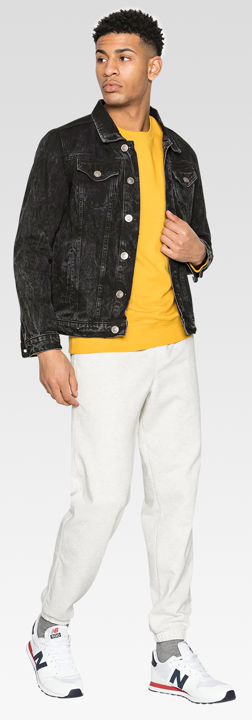A man in a black jacket and yellow t-shirt
